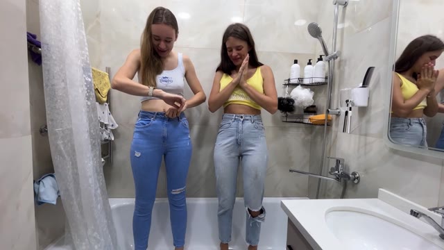 2 girls wetting pants in bath