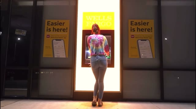 Girl wetting herself in front of ATM