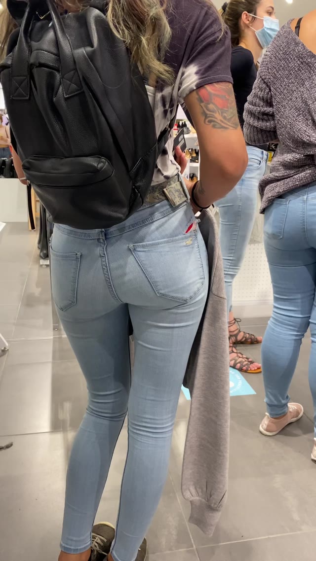 Jeans wetting in queue to pay in store