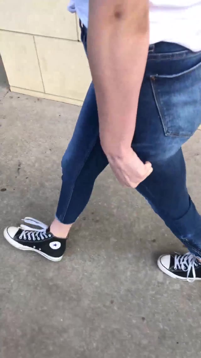 Desperately peeing her jeans in public