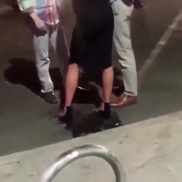Chick talking with 2 guys discretely pees standing