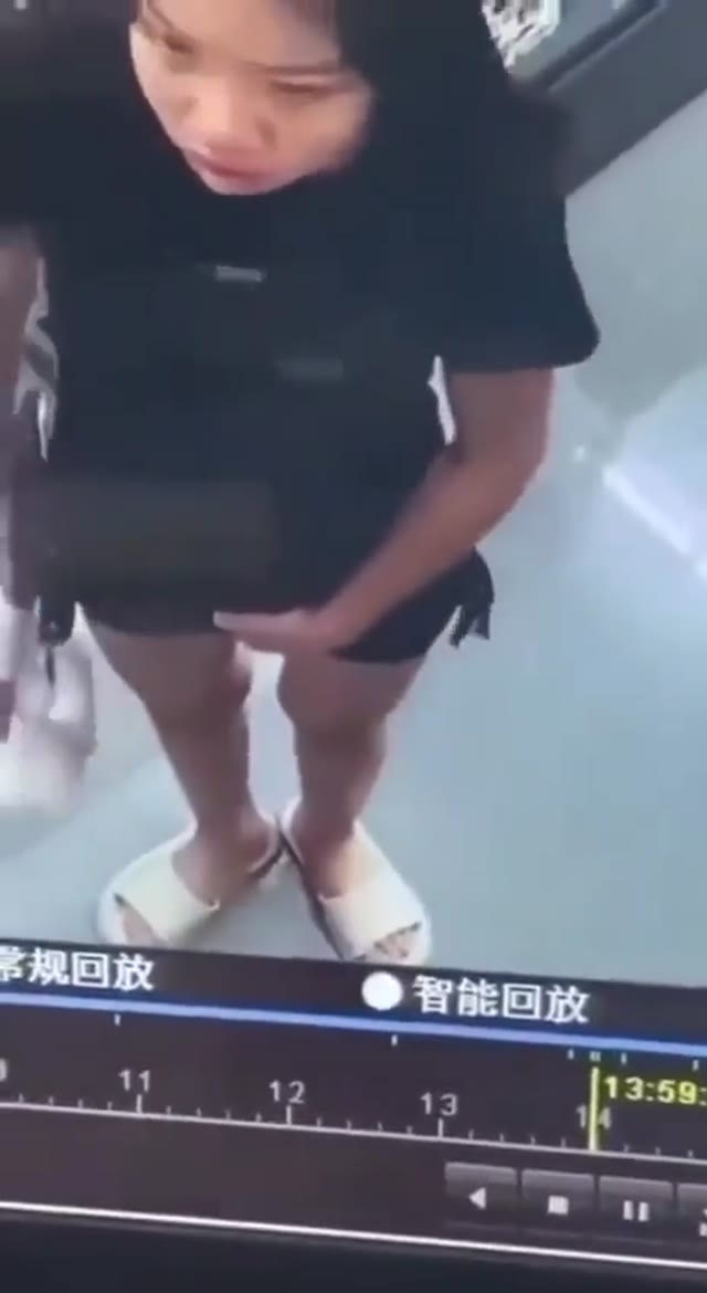 Girl pissing in store CCTV