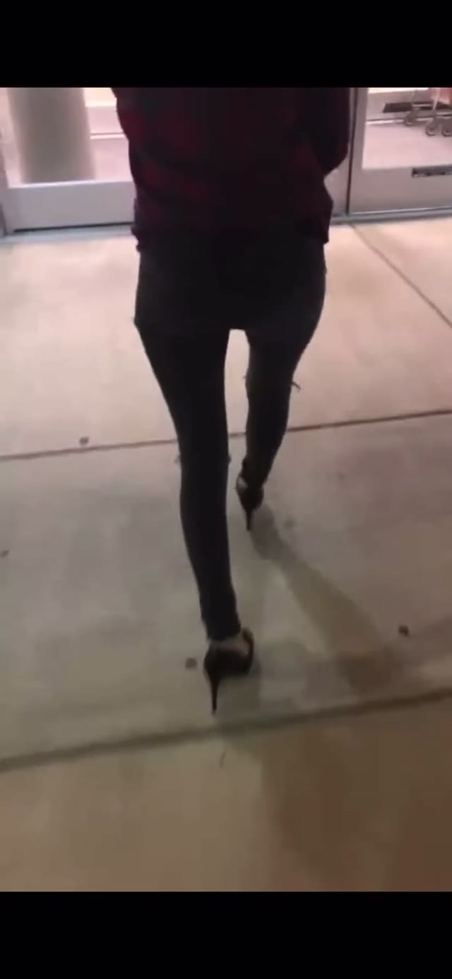 Girl wetting in black jeans public