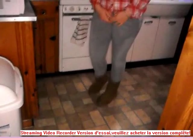 Girl peeing her jean in kitchen