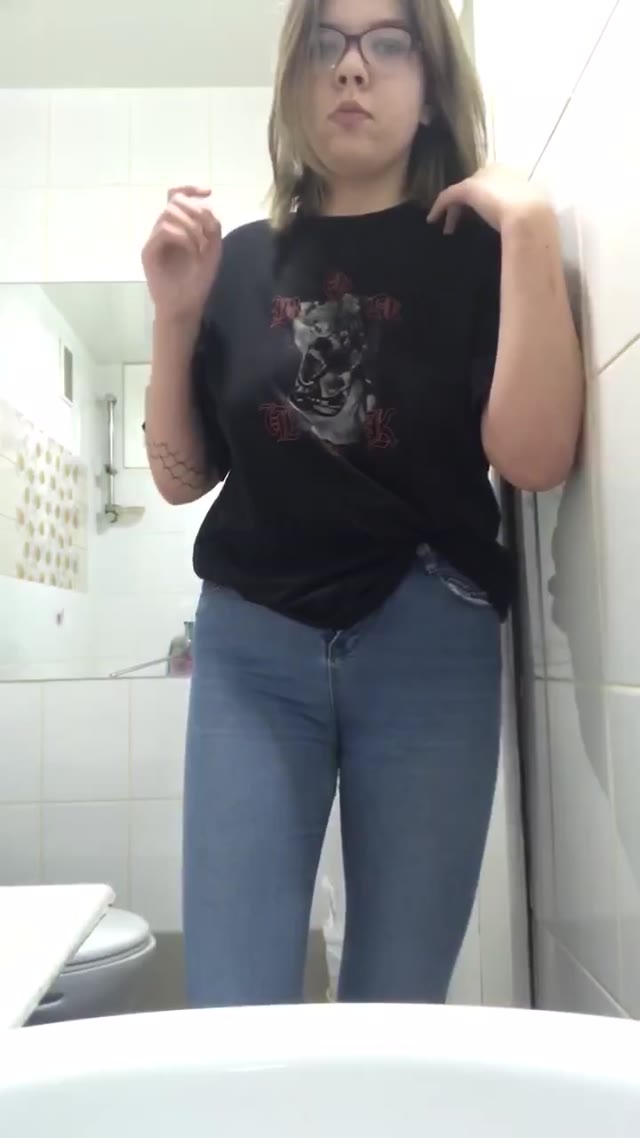 Girl pees her pants in front of toilets